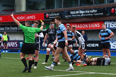 270124 - Cardiff v Bridgend - Indigo Group Premiership - Jason Harries of Cardiff is shown a yellow card by referee Adam Jones