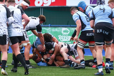 270124 - Cardiff v Bridgend - Indigo Group Premiership - Gareth Harvey of Bridgend Ravens is denied a try by Tom Habberfield of Cardiff