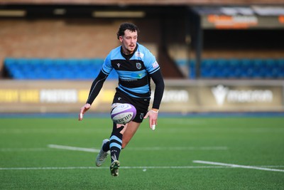 270124 - Cardiff v Bridgend - Indigo Group Premiership - James Beal of Cardiff chips and chases to score a try