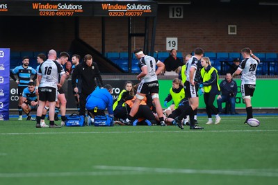 270124 - Cardiff v Bridgend - Indigo Group Premiership - Medical staff of Cardiff and Bridgend Ravens respond quickly to treat home player Joey Tomlinson