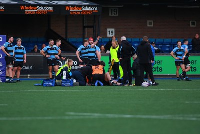 270124 - Cardiff v Bridgend - Indigo Group Premiership - Medical staff of Cardiff and Bridgend Ravens respond quickly to treat home player Joey Tomlinson