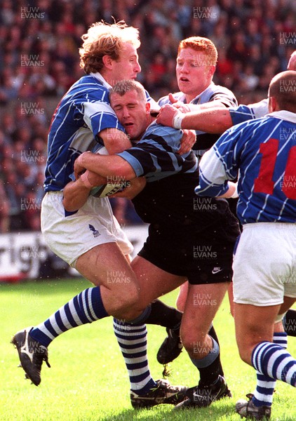 280996 - Cardiff v Bridgend - Leigh Davies of Cardiff is tackled by Gareth Thomas