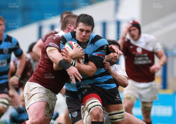 131012 Cardiff RFC v Bristol RFC - British and Irish Cup -Cardiff's Ellis Jenkins powers through the tackles of Bristol's Tom Channon(L) and Ruki Tipuna