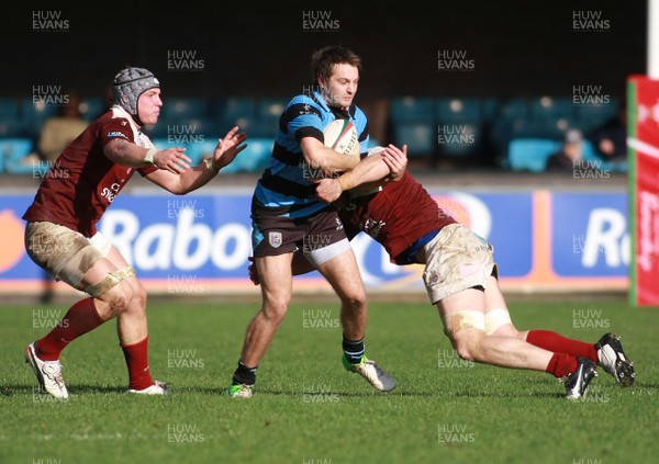 131012 Cardiff RFC v Bristol RFC - British and Irish Cup -Cardiff's Joe Griffin is tackled by Bristol's Iain Grieve