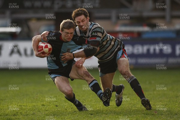 261209 - Cardiff RFC v Glamorgan Wanderers RFC - Principality Premiership - Cardiff's Owen Williams is caught by Glamorgan Wanderers' Simon Rosser