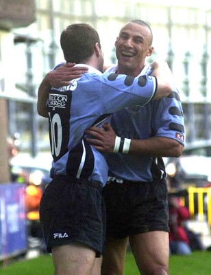 271001 - Cardiff v Glasgow - Heineken Cup - Cardiff's Iestyn Harris celebrates his first try with fellow scorer Anthony Sullivan