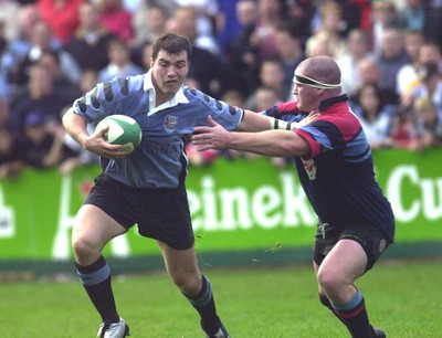 271001 - Cardiff v Glasgow - Heineken Cup - Cardiff's Iestyn Harris holds off Gordon McIlwham to score second try of game