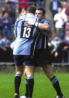 271001 - Cardiff v Glasgow - Heineken Cup - Cardiff's Iestyn Harris celebrates his second try with Jamie Robinson