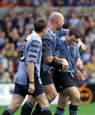 271001 - Cardiff v Glasgow - Heineken Cup - Cardiff's Iestyn Harris scores his 3rd try with Craig Quinnell and Jamie Robinson