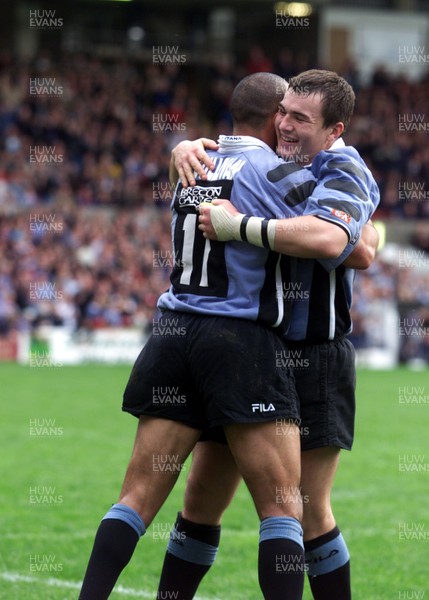 271001 - Cardiff v Glasgow - Heineken Cup - Cardiff's Iestyn Harris at the end of the game with a hug from Anthony Sullivan