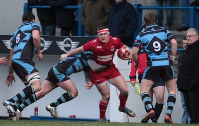 180212 Cardiff RFC v Llanelli RFC - Swalec Cup -Llanelli's Iolo Evans is tackled by Cardiff's Harrt Robinson