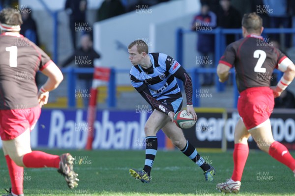 271012 Cardiff RFC v Llanelli RFC - Principality Building Society Premiership - Cardiff's Dan Fish feeds the ball out to the backs 