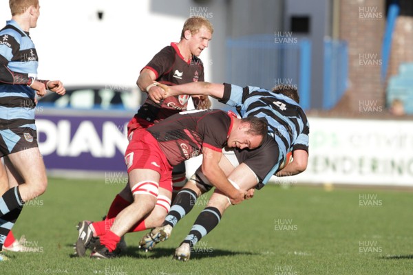 271012 Cardiff RFC v Llanelli RFC - Principality Building Society Premiership - Llanelli's Craig Hawkins brings Alwyn Lee of Cardiff down 