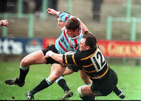 140195 - Cardiff v Maesteg - Chris John of Cardiff is tackled by Matthew Brown