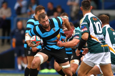 010918 - Cardiff RFC v Merthyr RFC - Principality Premiership - Morgan Allen of Cardiff is tackled by Patrick McBride of  Merthyr 