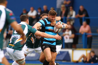 010918 - Cardiff RFC v Merthyr RFC - Principality Premiership - Adam Jones of Cardiff is tackled by Nick White and Richard Powell of  Merthyr 