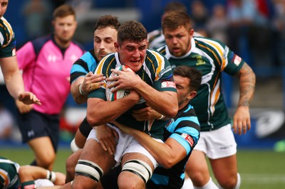 010918 - Cardiff RFC v Merthyr RFC - Principality Premiership - Patrick McBride of Merthyr is tackled by Kieran Martin and Adam Jones of Cardiff