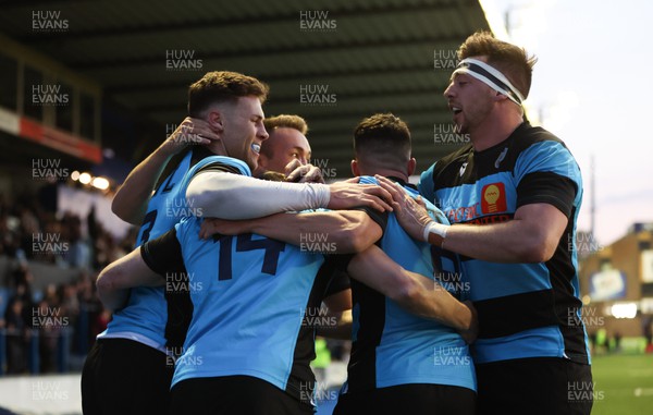 280422 - Cardiff v Merthyr, Indigo Premiership - James Beal of Cardiff is congratulated by team mates after scoring try
