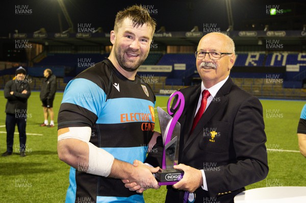 280422 - Cardiff v Merthyr, Indigo Premiership - Dave Young of the WRU presents Morgan Allen of Cardiff with the Indigo Premiership trophy