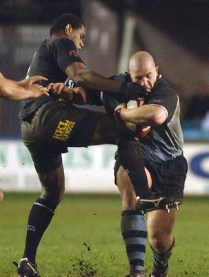 280203 - Cardiff v Neath - Welsh Premiership - Cardiff's John Yapp takes on Alfie Mocelutu