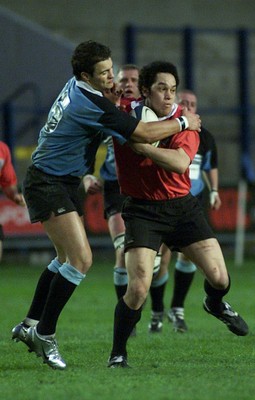 050405 Cardiff vs Newbridge Welsh Premier  LeagueLeon Andrews tries to fend off fullback Ross JonesDarren Griffiths/