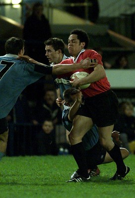 050405 Cardiff vs Newbridge Welsh Premier  LeagueLeon Andrews hands off Tom Lampert(7) as Mark Addis hangs on Darren Griffiths/