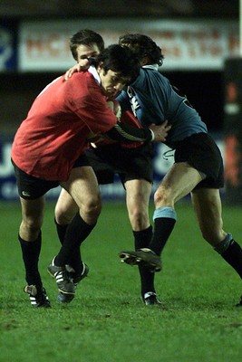 050405 Cardiff vs Newbridge Welsh Premier  LeagueLiam Roberts ducks under the tackle of Chris MillerDarren Griffiths/