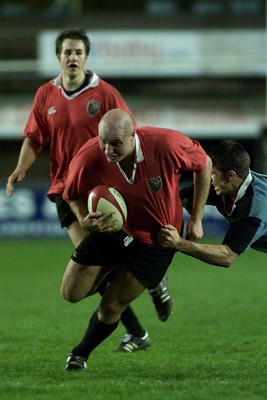 050405 Cardiff vs Newbridge Welsh Premier  LeagueGeraint Morris tries to escape the desperate tackle of Tom LampertDarren Griffiths/