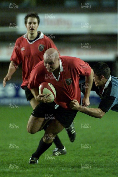 050405 Cardiff vs Newbridge Welsh Premier  LeagueGeraint Morris tries to escape the desperate tackle of Tom LampertDarren Griffiths/