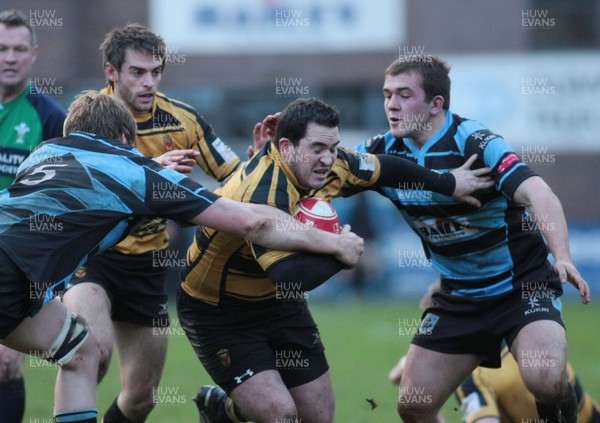 02.01.12 Cardiff RFC v Newport RFC - Principality Premiership - Newport' Scott Williams is tackled by Cardiff's Matthew Screech(5) and Ieuan Davies 