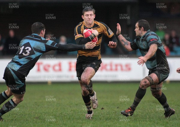 02.01.12 Cardiff RFC v Newport RFC - Principality Premiership - Newport's Alan Awcock tries to exploit a gap between Cardiff's Richard Smith(13) and Rhys Shellard  