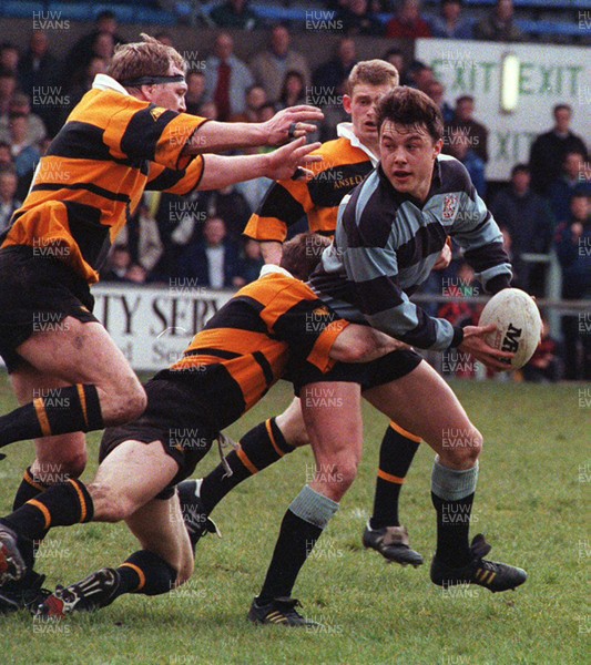 170493 - Cardiff 36 v 20 Newport -  Simon Hill of Cardiff is tackled by David Llewellyn 