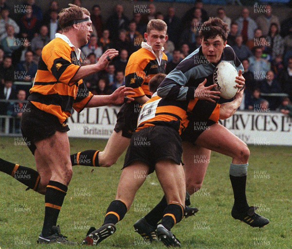 170493 - Cardiff 36 v 20 Newport -  Simon Hill of Cardiff is tackled by David Llewellyn 