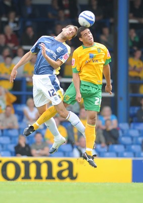 23.08.08 - Championship Football Cardiff City v Norwich City Cardiff's Roger Johnson and Norwich's Darel Russell go for a high ball 