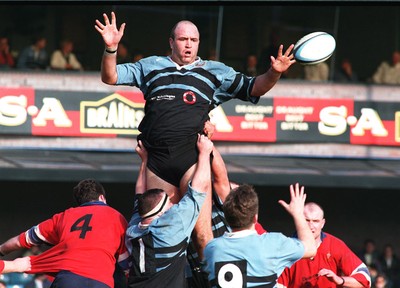 220397 - Cardiff v South Wales Police - Derwyn Jones of Cardiff gets the ball away