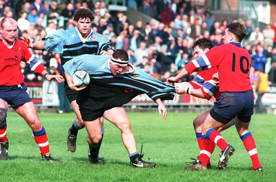 220397 - Cardiff v South Wales Police - Andrew Lewis of Cardiff is collared by Steve Rees and Justin Price