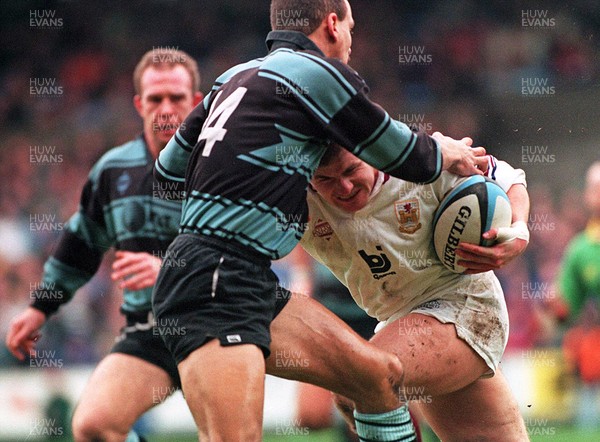 070195 - Cardiff v Swansea - Shaun Marshall of Swansea charges through Steve Ford 