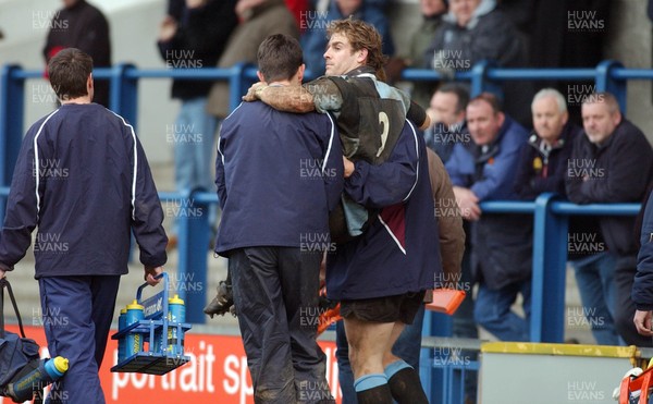 110206 - Cardiff v Swansea - Cardiff's Owen Ruttley is helped from the field with an injury 