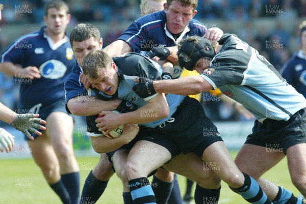 120403 - Cardiff v Swansea - Welsh Premiership - Cardiff's Craig Morgan is held by Richard Rees