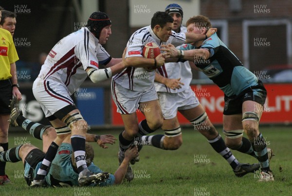 13.01.08 Cardiff RFC vs. Swansea RFC. Principality Premiership, Cardiff.    Damian Karauna steps through Rhys James's tackle as he fends off Adam Powell.    