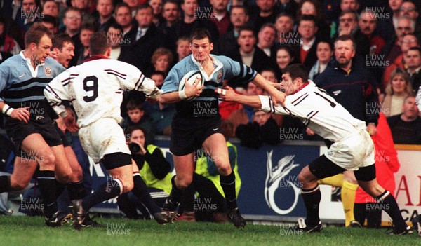 131297 - Cardiff v Swansea -  Liam Botham of Cardiff is tackled by Richard Rees (R) and Andy Booth (9)