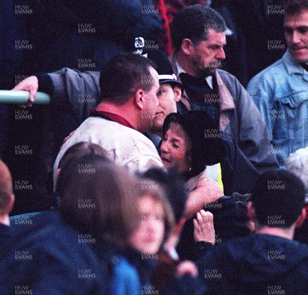 131297 - Cardiff v Swansea -  Garin Jenkins of Swansea comforts a woman after his father is taken ill