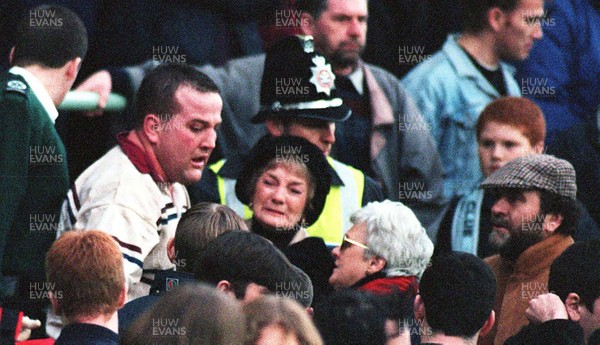 131297 - Cardiff v Swansea -  Garin Jenkins of Swansea comforts a woman after his father is taken ill