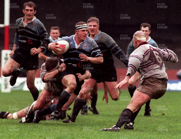 260497 - Cardiff v Swansea - SWALEC Cup Final -  Cardiff's Leigh Davies is tackled by Stuart Davies