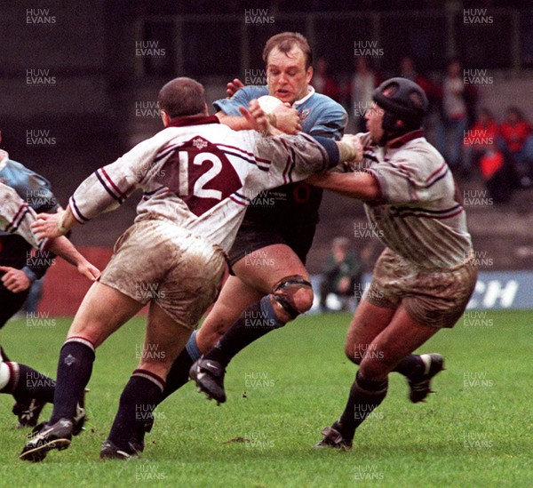 260497 - Cardiff v Swansea - SWALEC Cup Final -  Cardiff's Mike Hall takes on Scott Gibbs and Rob Appleyard (rt)