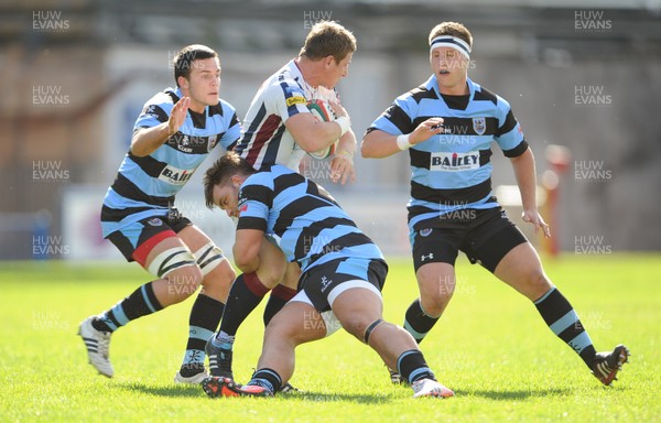 290912 - Cardiff v Swansea - Principality Premiership -Nick Harwood of Swansea is tackled by Will-Griff John of Cardiff