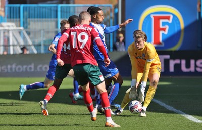 050425 - Carlisle United v Newport County - Sky Bet League 2 - Goalkeeper Gabe Breeze of Carlisle saves from David Ajiboye of Newport