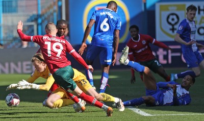 050425 - Carlisle United v Newport County - Sky Bet League 2 - Goalkeeper Gabe Breeze of Carlisle saves from David Ajiboye of Newport and also from Shane McLoughlin of Newport