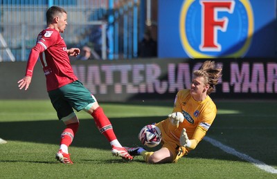 050425 - Carlisle United v Newport County - Sky Bet League 2 - Goalkeeper Gabe Breeze of Carlisle saves from Kieron Evans of Newport