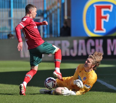 050425 - Carlisle United v Newport County - Sky Bet League 2 - Goalkeeper Gabe Breeze of Carlisle saves from Kieron Evans of Newport